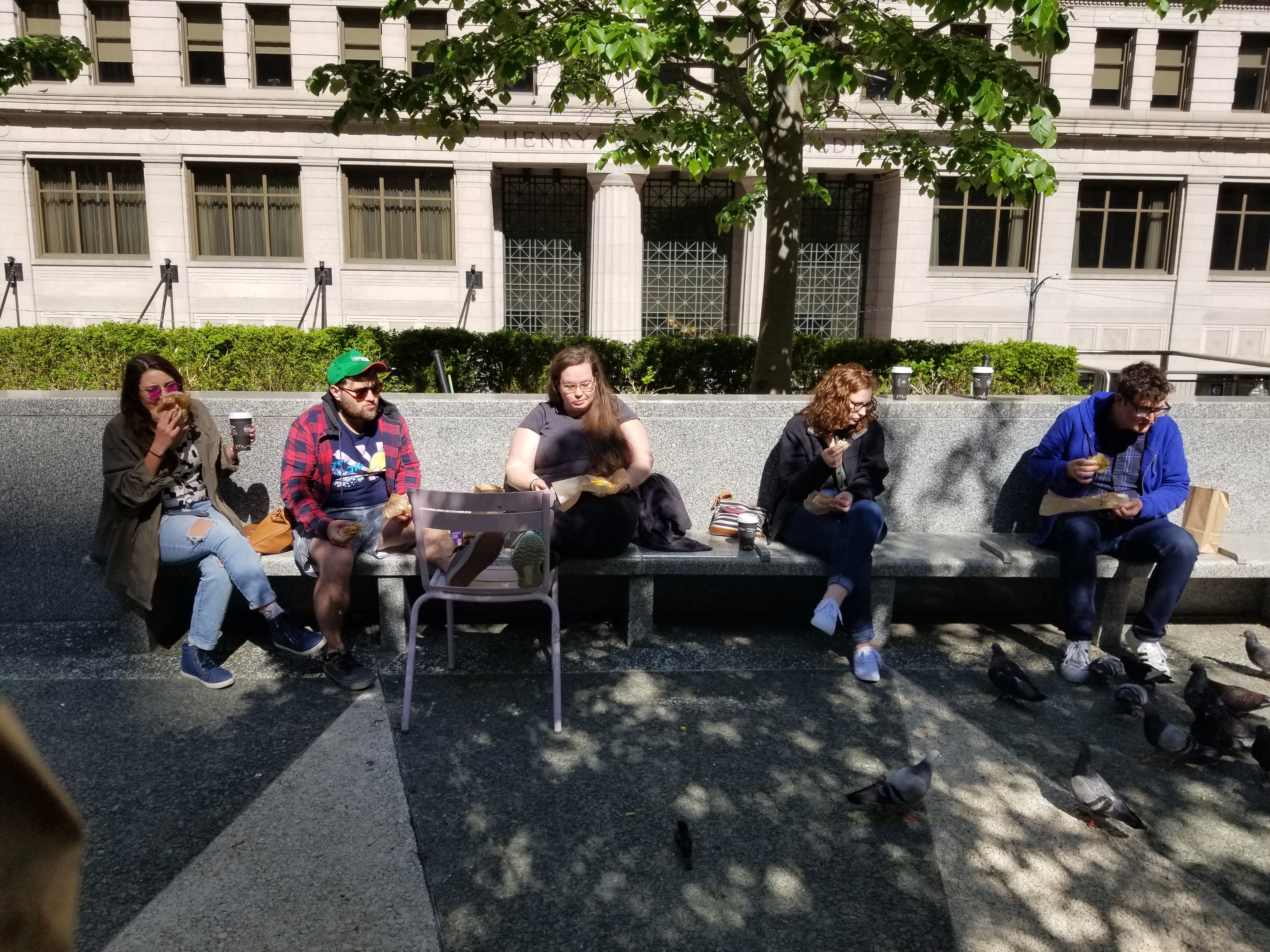 Five friends eating bagels